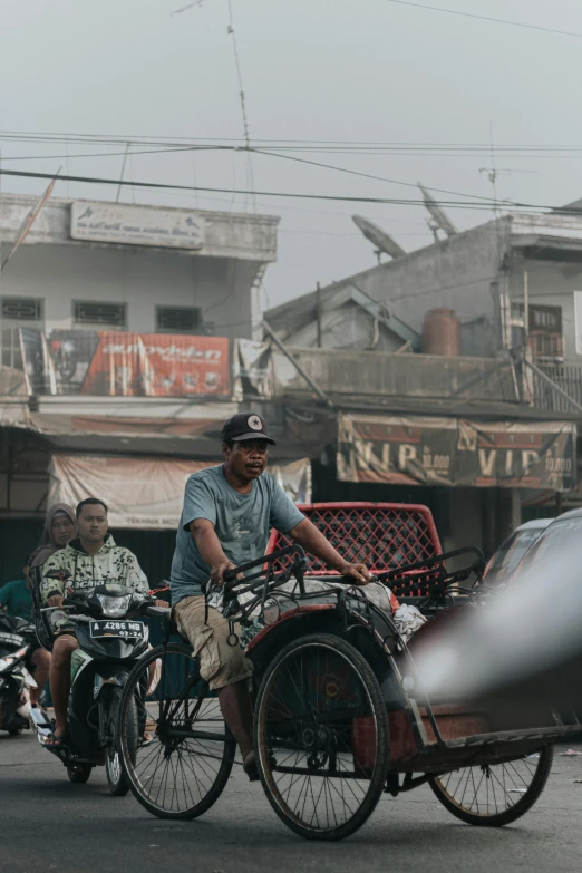 there are three people riding on bikes in the street