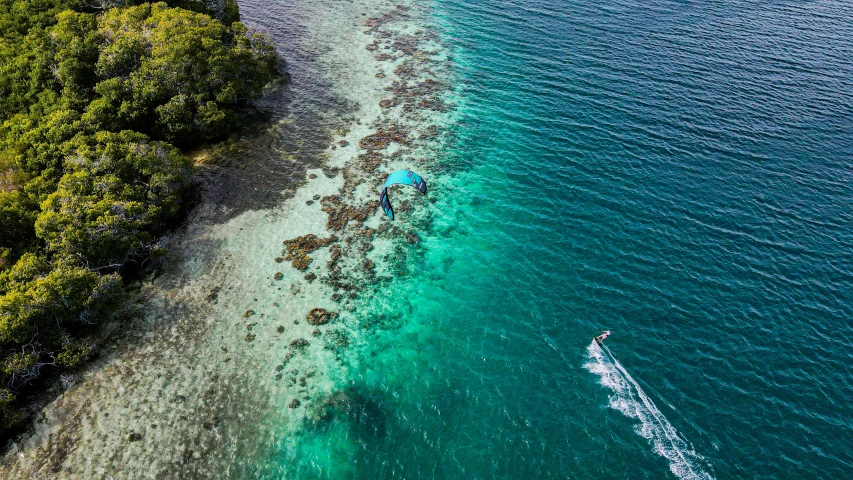 a small boat on an island next to the ocean