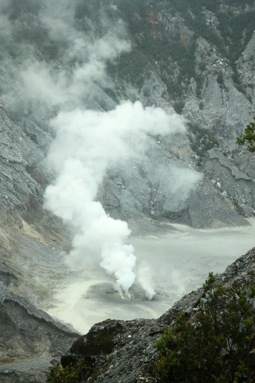 steam rises up from the water in a valley