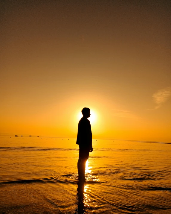 a person on the water looking at the sky