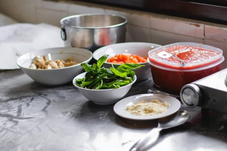 a stainless steel table with a variety of food on it