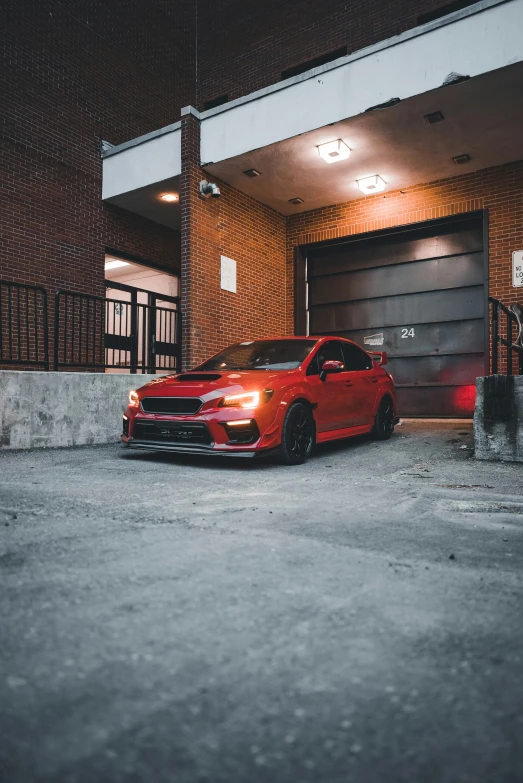 an orange car parked in front of a garage