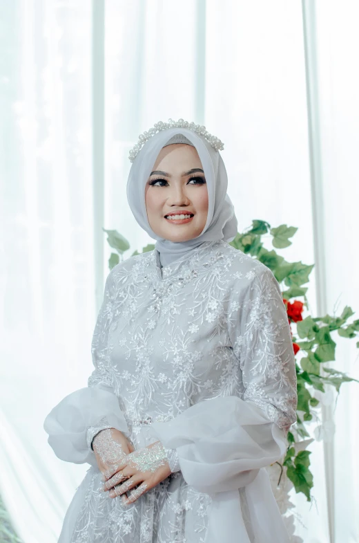 a woman in white wedding outfit and pearls