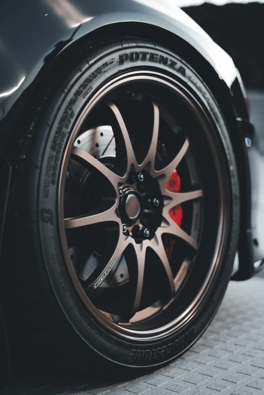 the rear tire on a black sports car