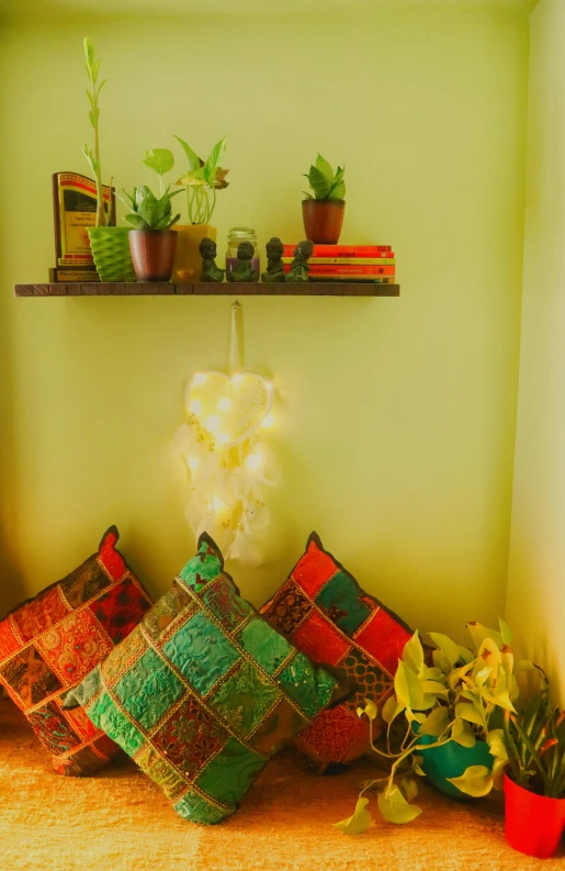 a small shelf has potted plants on it