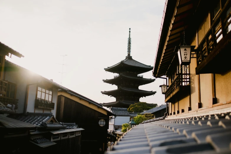 a pagoda next to another building with windows