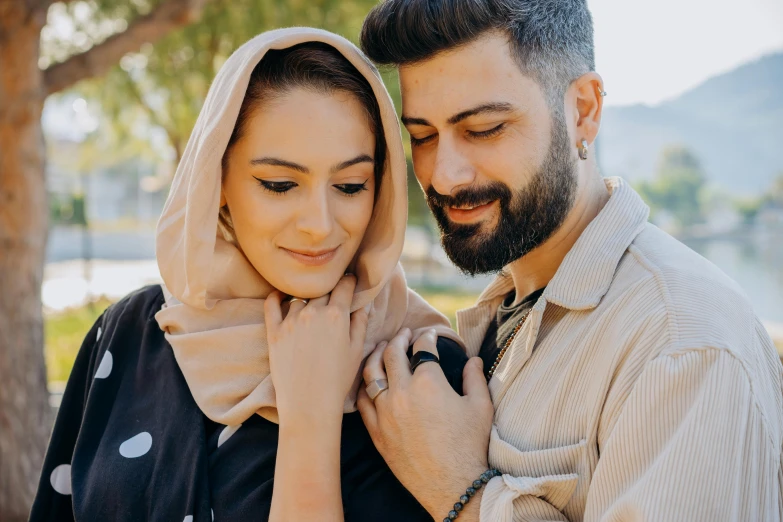 man and woman with a headscarf on their heads