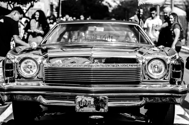 vintage black and white pograph of a car on a city street