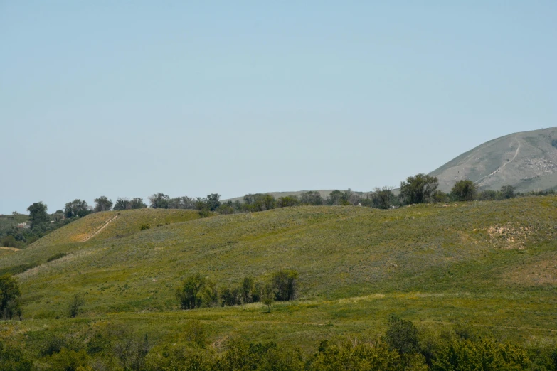 some green hills with hills and trees