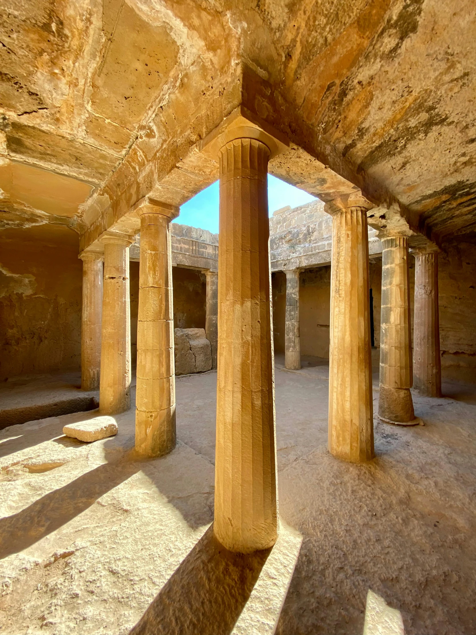 ancient ruins with columns and concrete floors