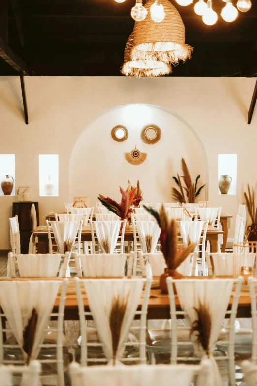 a very clean dining room with tall chandeliers