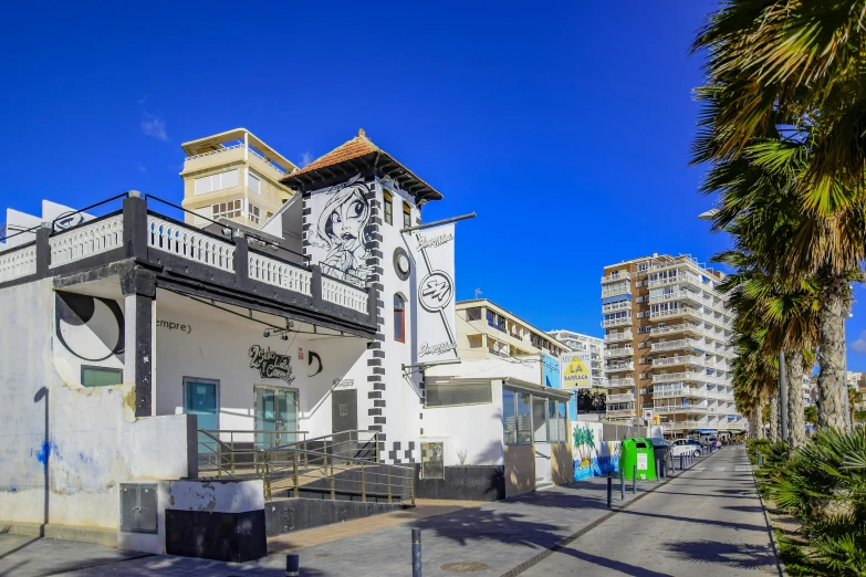 a street view of buildings that have a clock on it