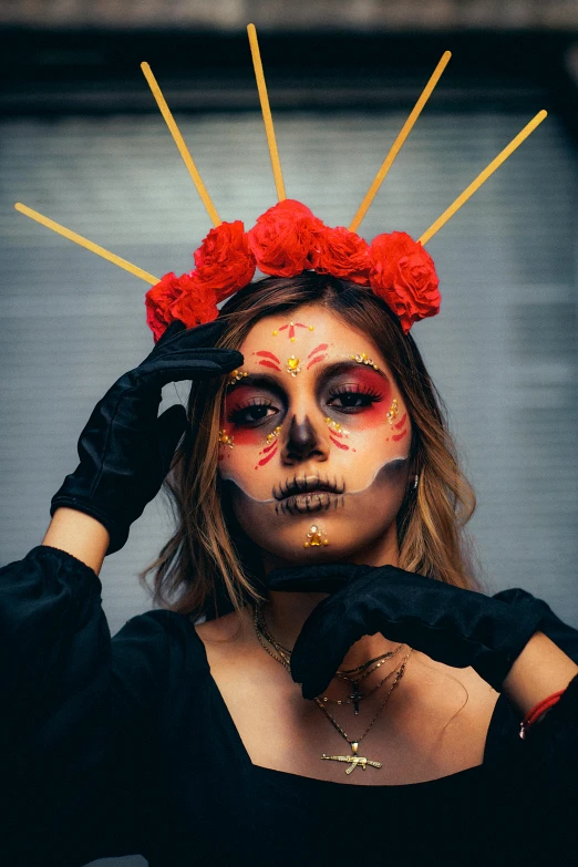 a woman with makeup on posing with sticks