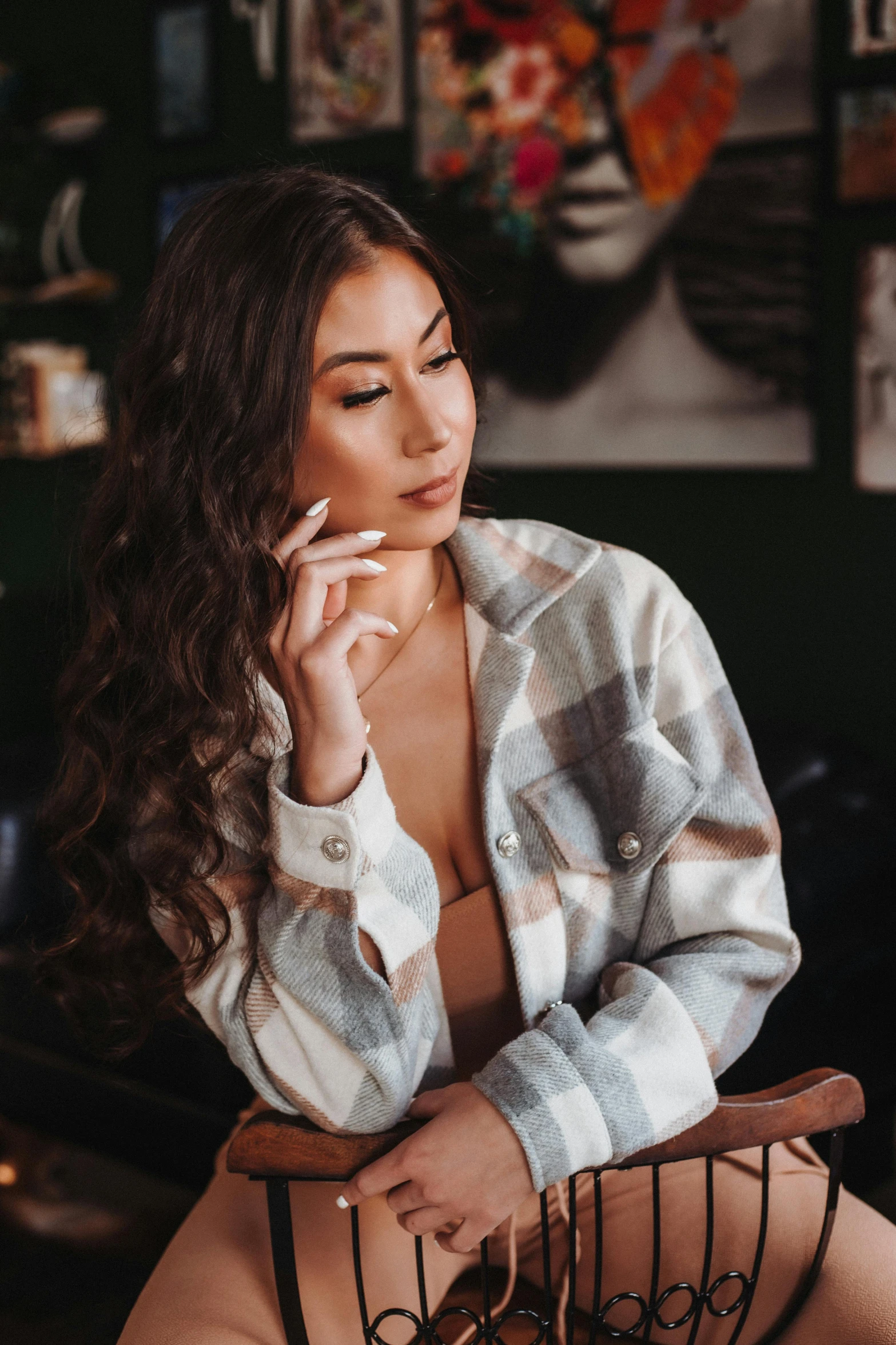 a woman sitting down smoking a cigarette