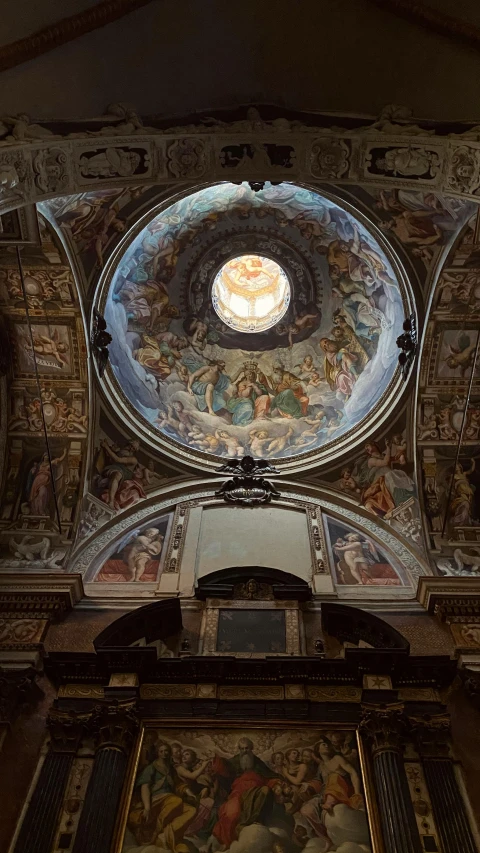 the ceiling of a room with an ornate painting