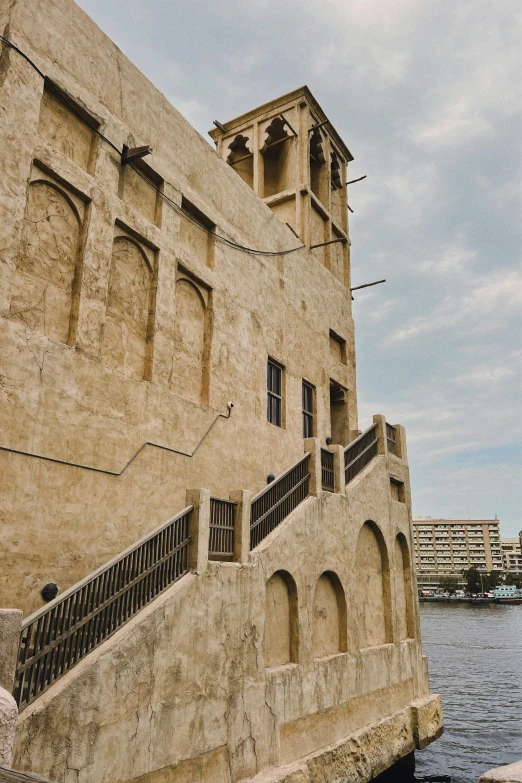 an old building beside a water way