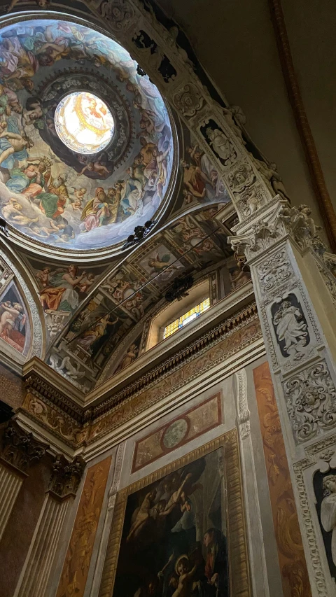 an elaborate ceiling with paintings on it