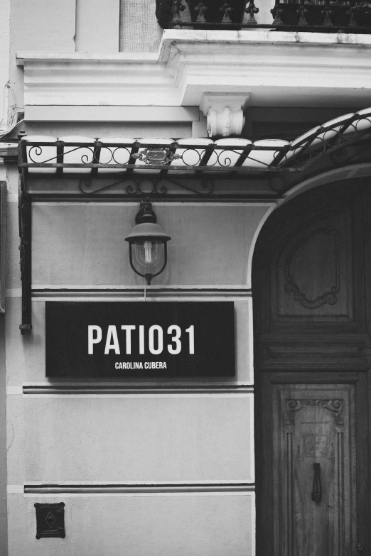 a sign that says pat 011 hanging off the side of a building