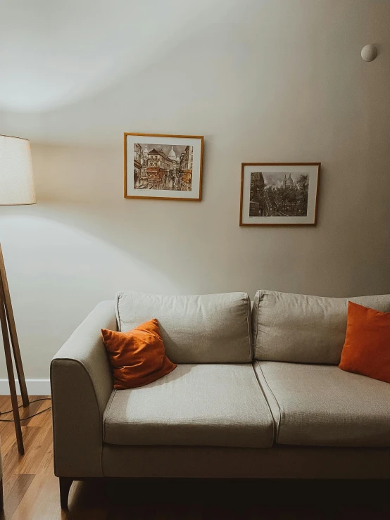 a white couch and lamp in a room