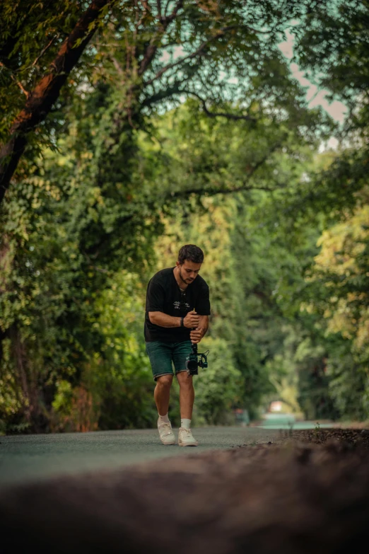 a man walking down the road using a cell phone