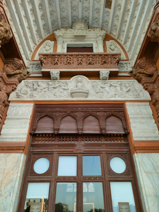 a close up s of an ornate carved wooden window frame