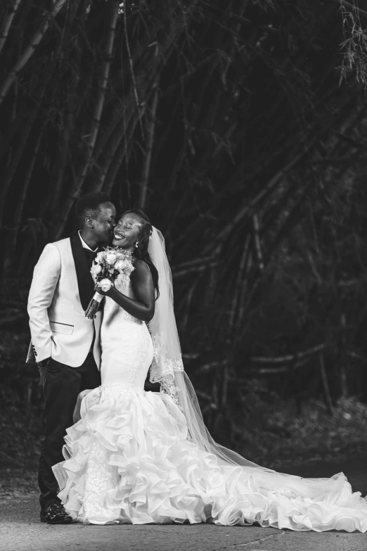 black and white wedding po, bride and groom posing together