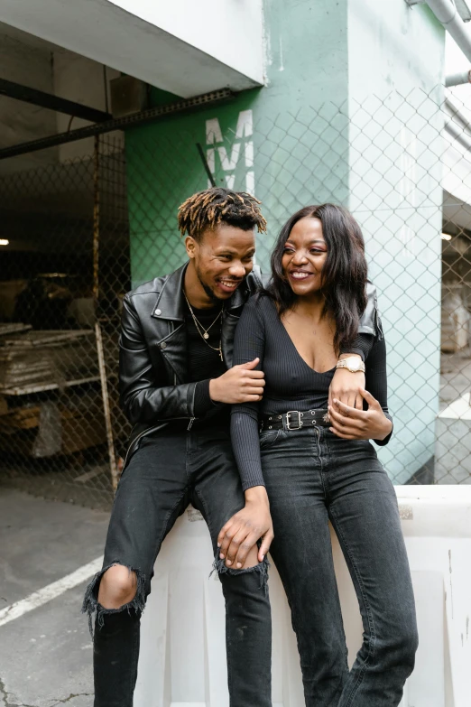 a couple is smiling and posing for a po together