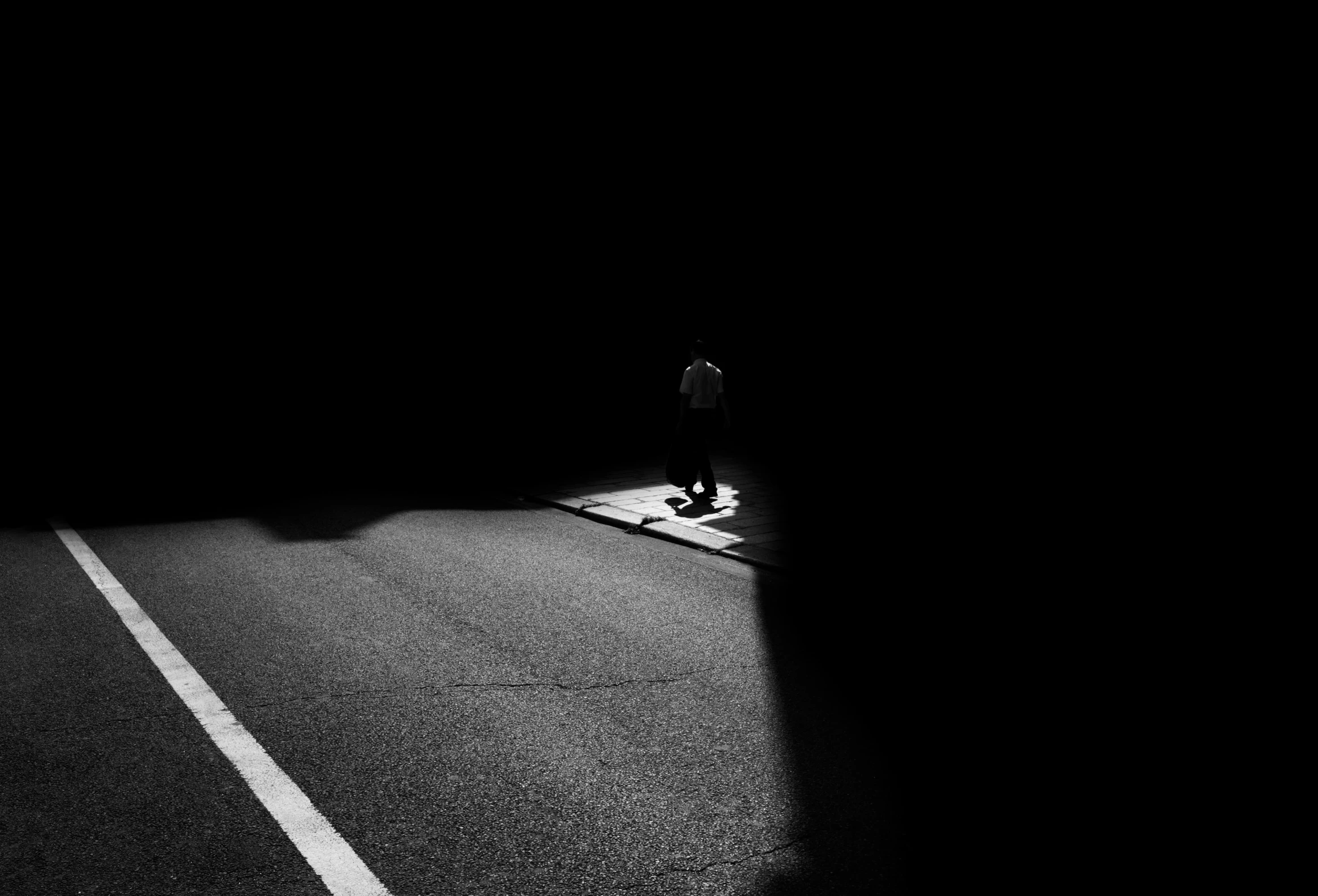 two people standing next to each other on the road