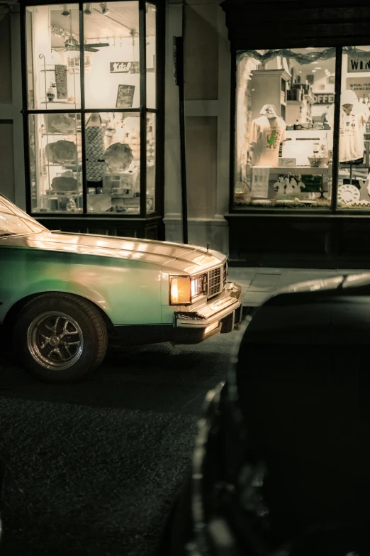 an old fashioned car is parked in a parking lot