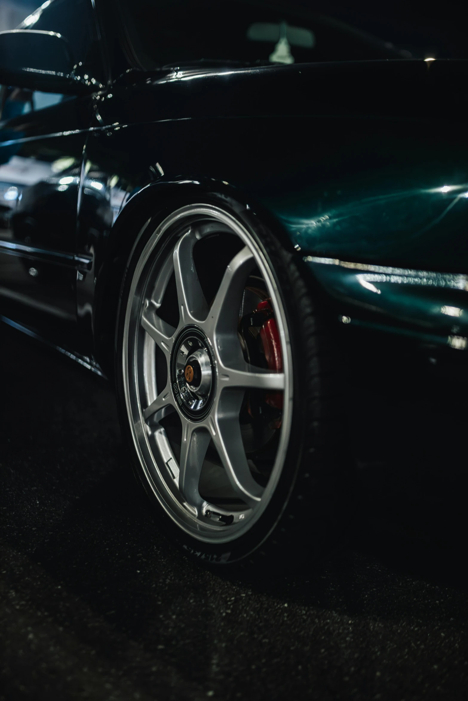 close up s of shiny and chrome rims on car