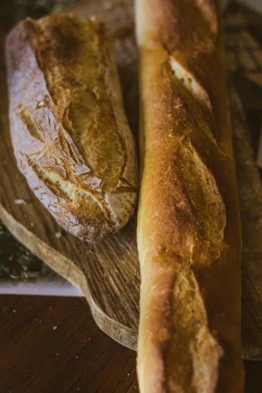 a couple of breads on a  board