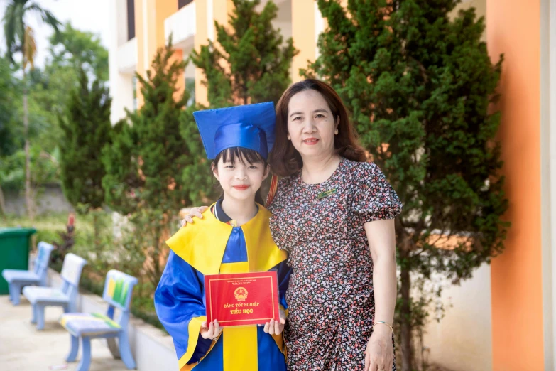 a woman and a boy standing next to each other