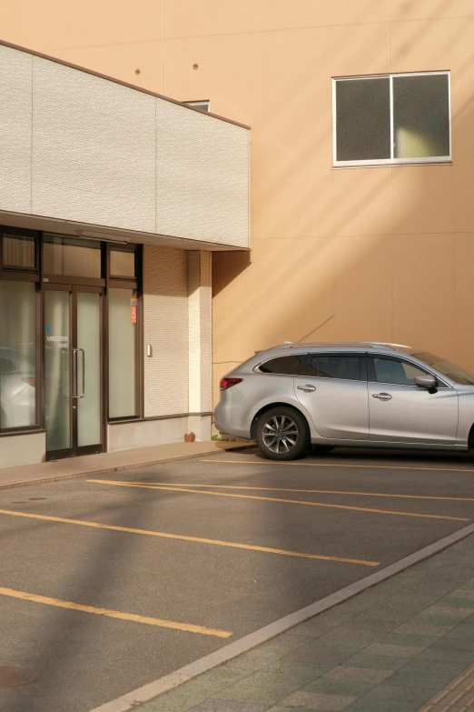 a car is parked in front of a window