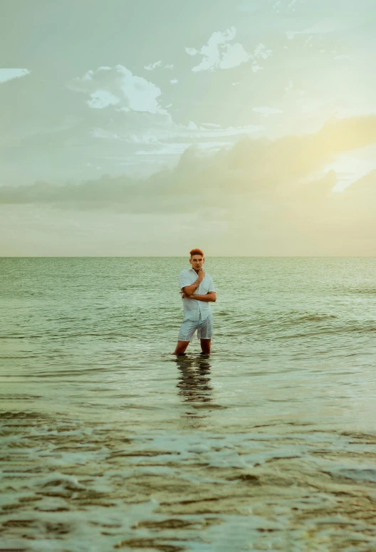 a man is wading through a body of water