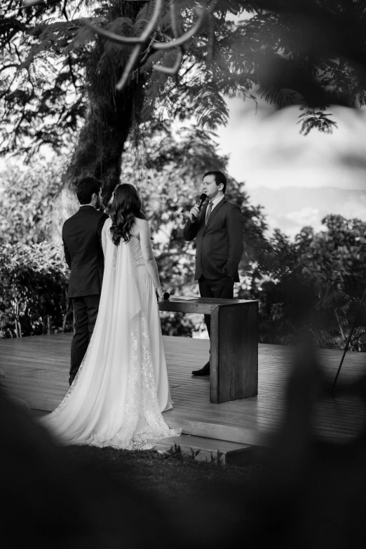 a bride and groom are standing in front of the alter