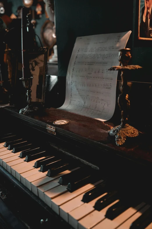 a piano sitting next to a po of an older man