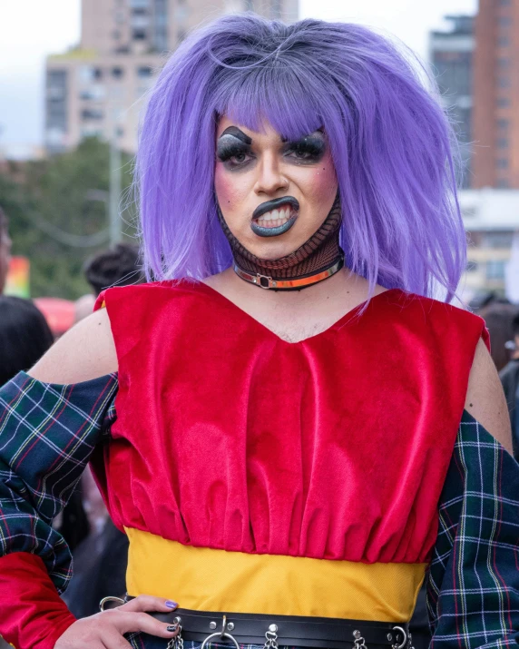 a woman dressed in an elaborate outfit is posing for the camera