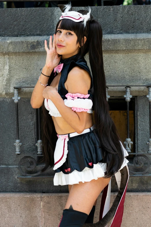 a girl with long black hair posing in dress