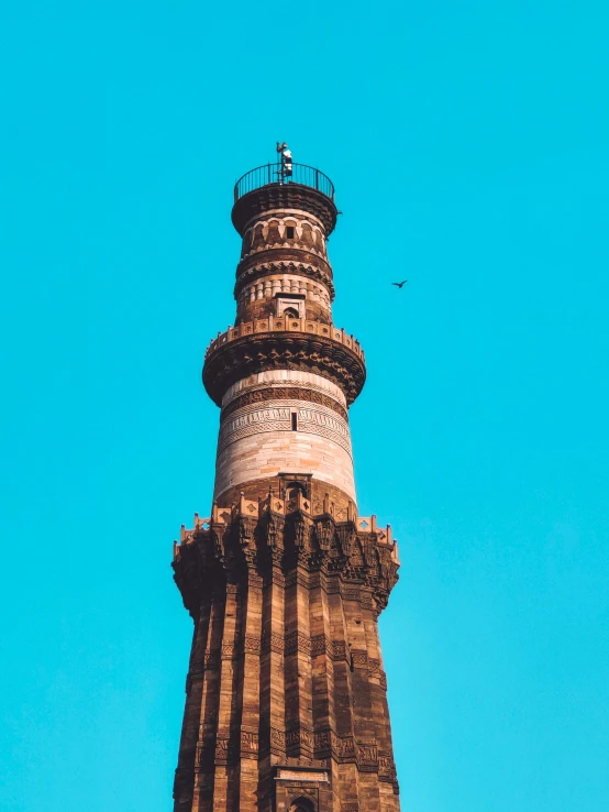 a tower that is in the middle of a blue sky