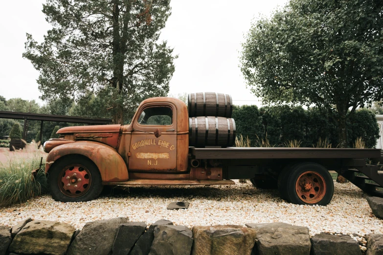 a vintage pick up truck parked on gravel