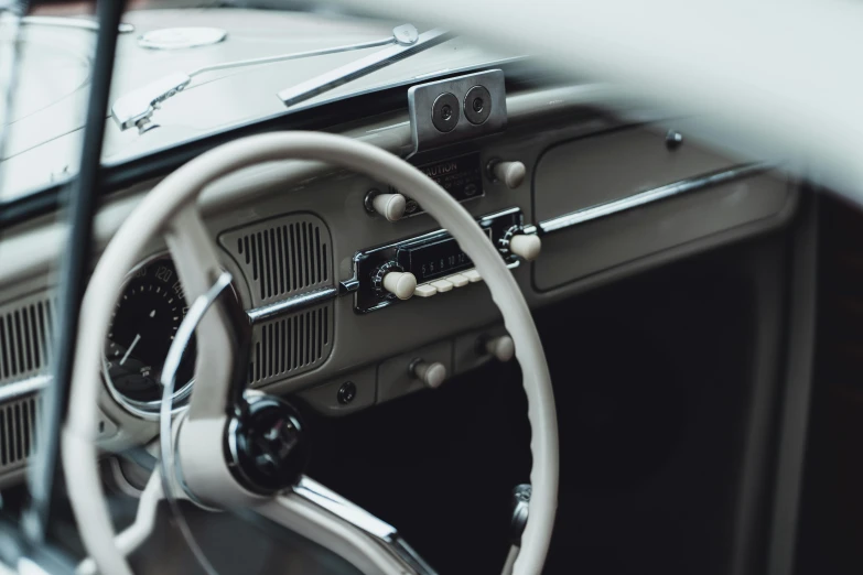 the steering wheel and dashboard of an old car