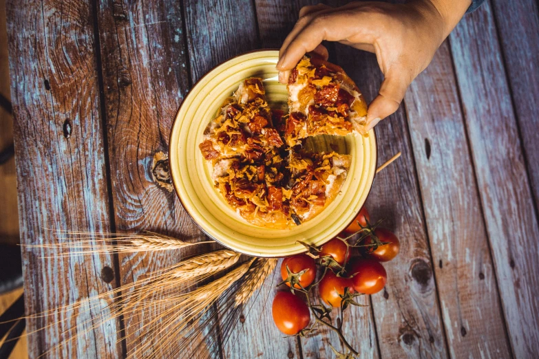 someone serving a bunch of food on a plate