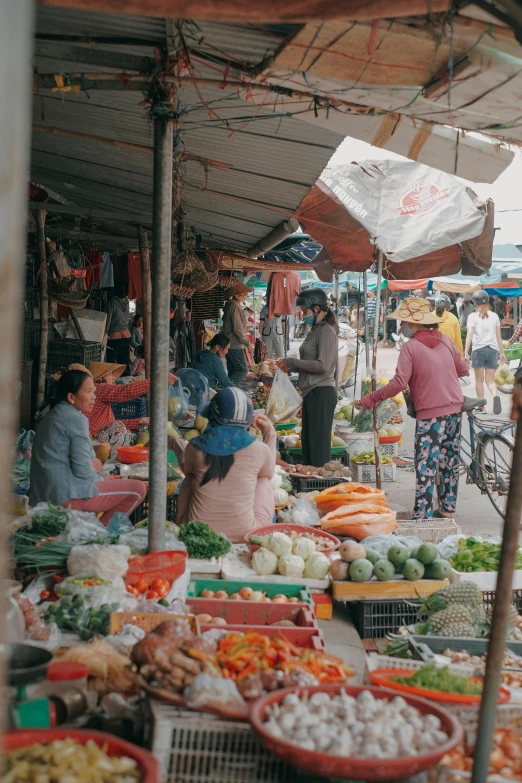 an outdoor market is full of food, fruits and vegetables