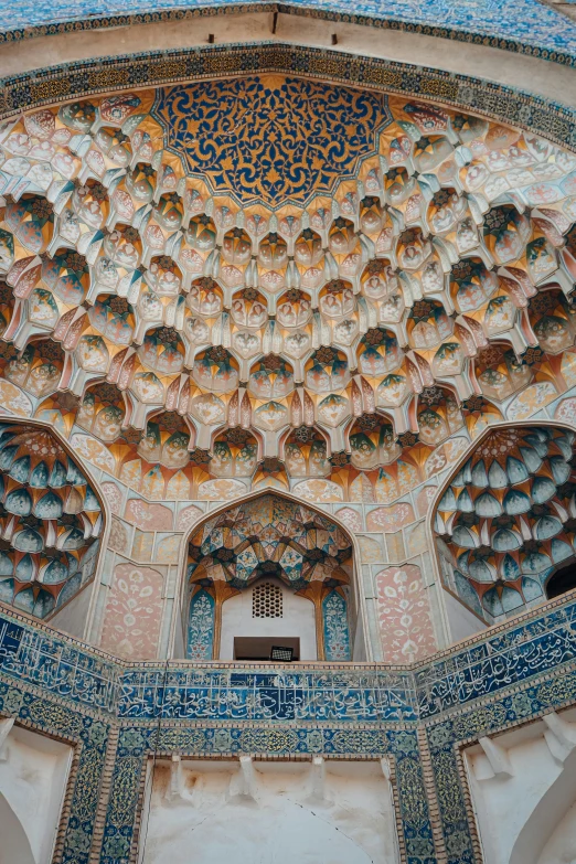 an ornately decorated dome with many lamps in it