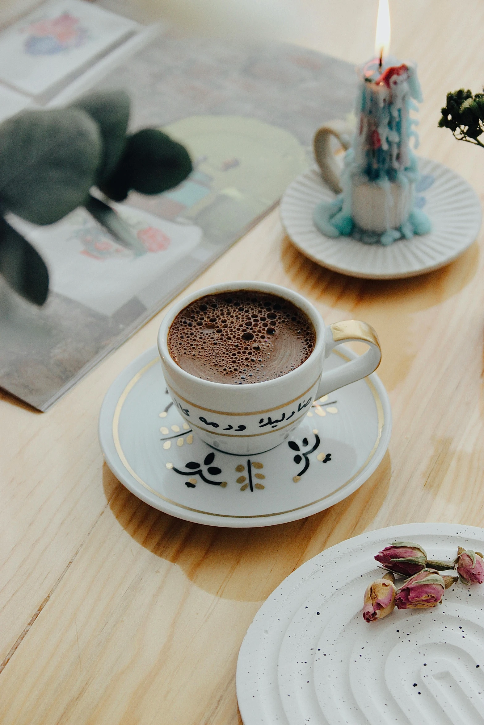 two white plates topped with food next to a cup of coffee