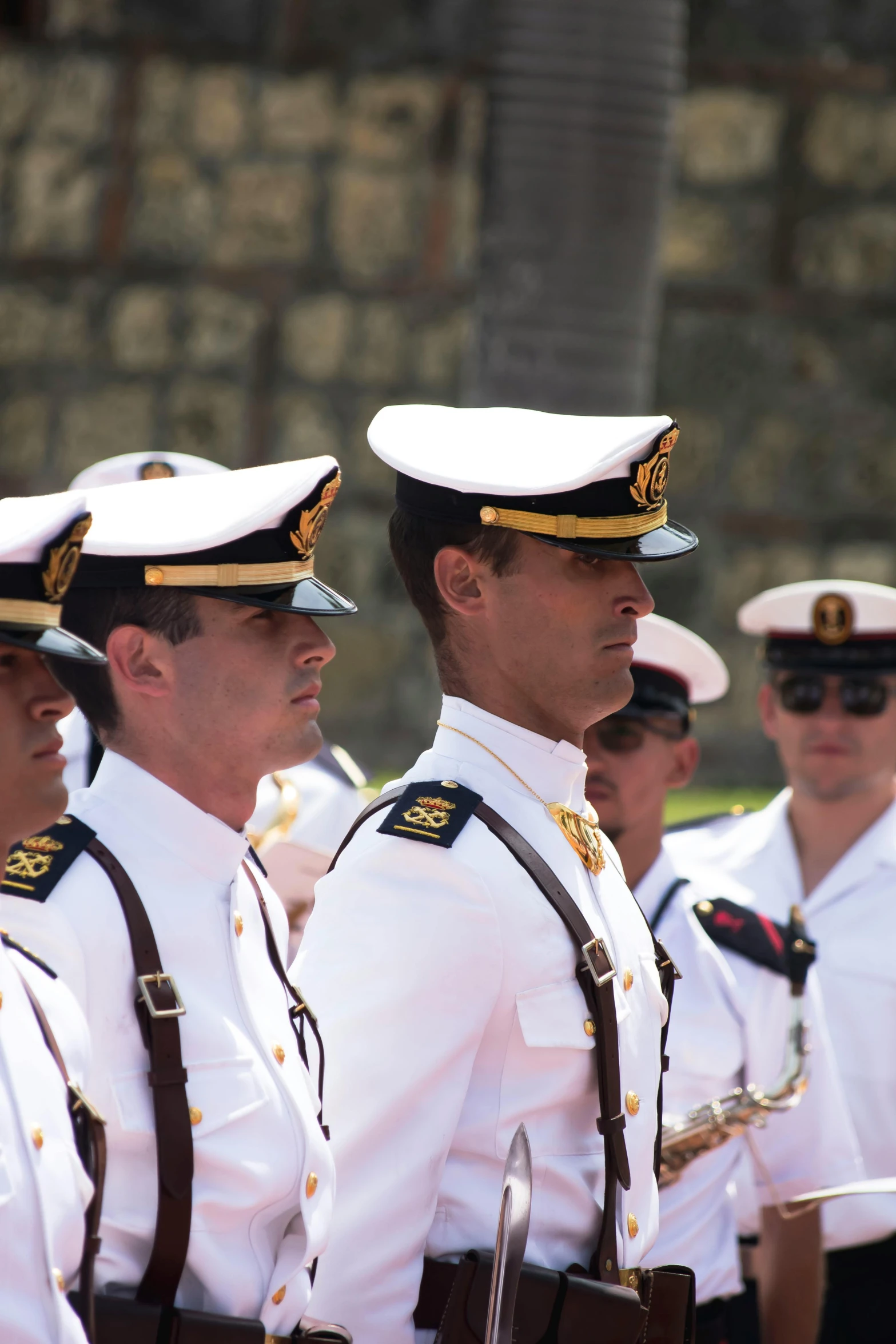a group of military men are dressed in white