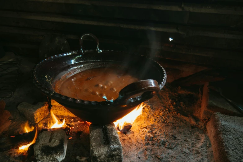 some  food sits in front of a campfire