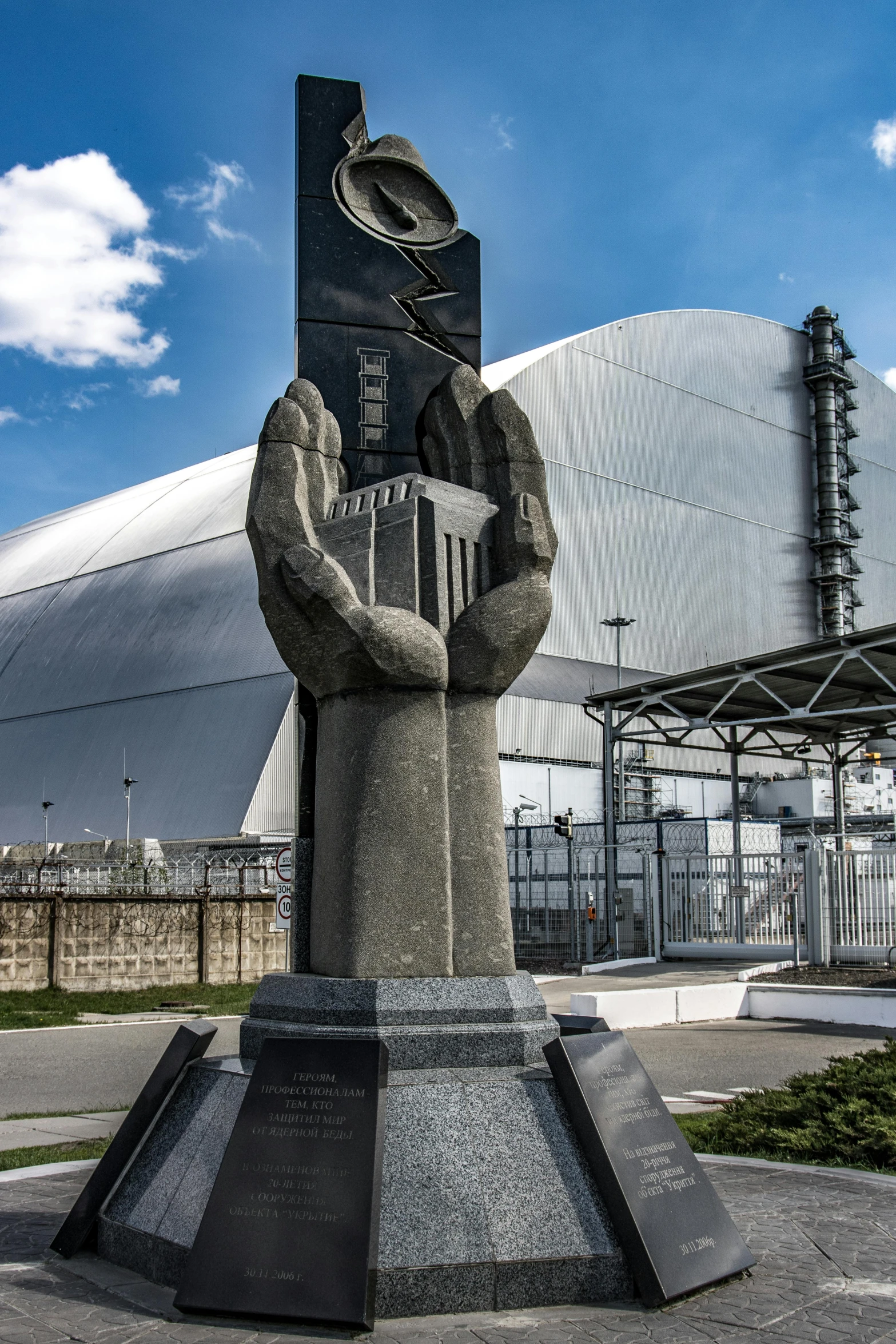 a tall building with some statues near it