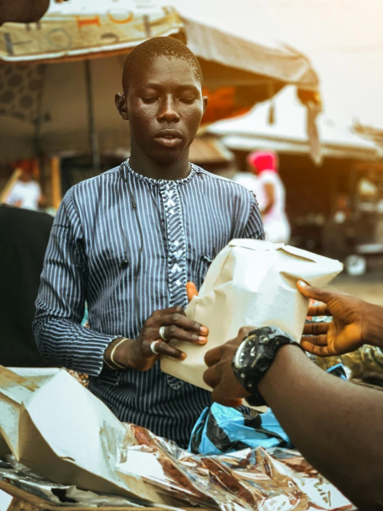 a man is filling up a jug with soing