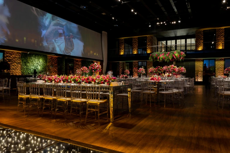 a room with chairs, tables and lights